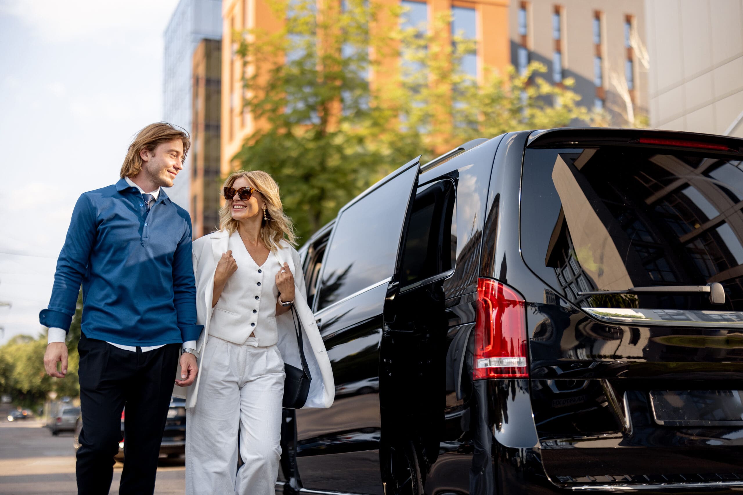 Business people get out of a minivan taxi istanbul luxury transfer
